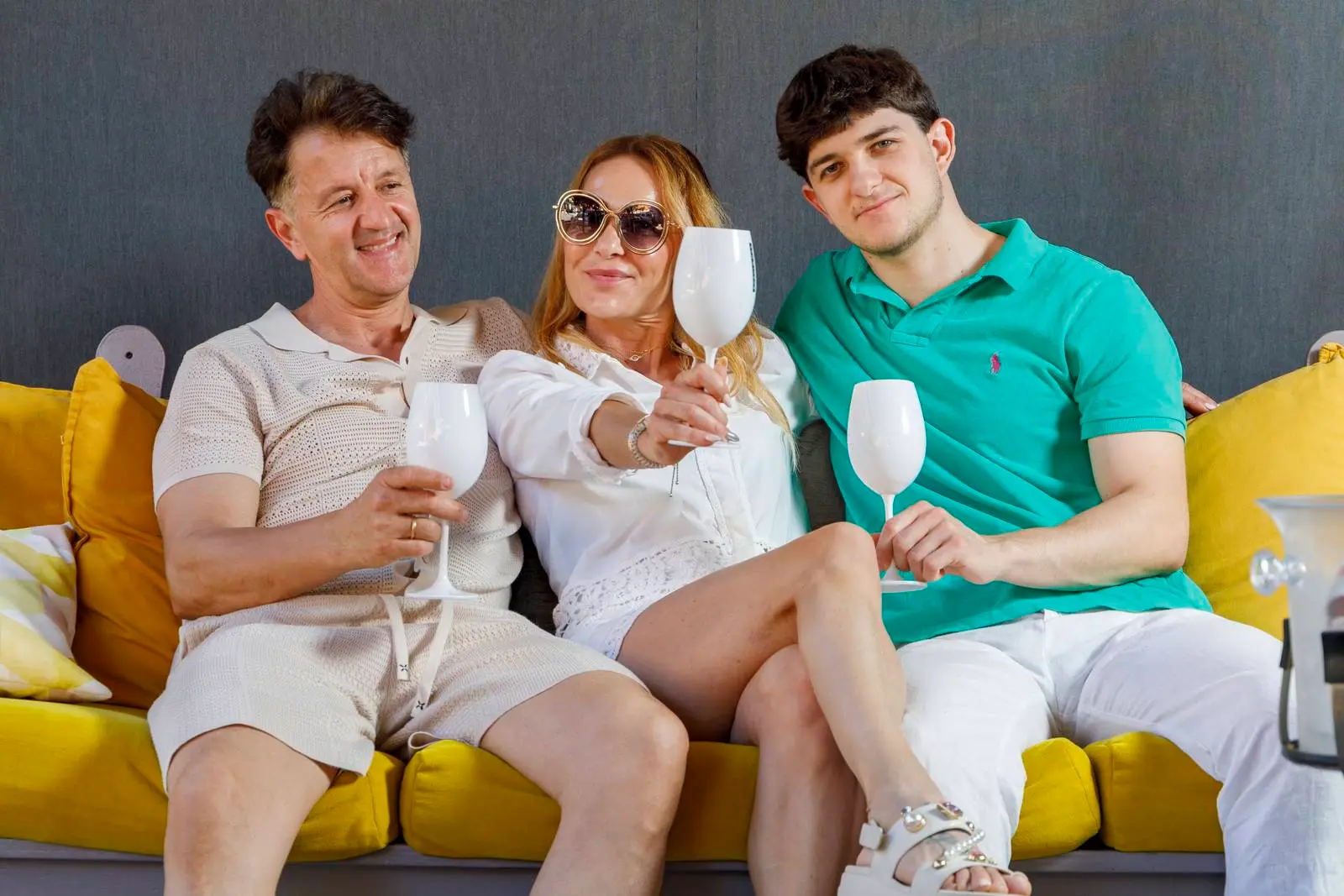 Three guests raising glasses at ENCANTO